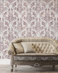 Wildwood Silk damask wallpaper in mauve and cream tones displayed on elegant living room accent wall