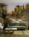 Autumn forest stream Woodland Haven wallpaper mural in earth tones behind green velvet sofa