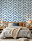 Worn Chevron blue geometric peel and stick wallpaper adding character to a cozy bedroom