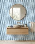 Worn Chevron blue geometric peel and stick wallpaper creating ambiance in a serene bathroom