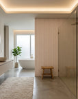 Woven Blush blush herringbone line wallpaper creating ambiance in a serene bathroom