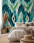 Peel and stick wallpaper featuring an abstract wave pattern in blue and green Ikat style.