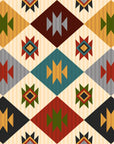 Southwestern geometric wallpaper with repeating diamond motifs in warm earth tones including rust red, mustard yellow, sage green, teal, charcoal, and ivory.