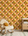 Woven Sway retro orange and green chevron wallpaper as a feature wall in a bright home office