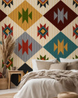 A striking palette of rust red, mustard yellow, sage green, teal, charcoal, and ivory defines this repeating Southwestern geometric wallpaper with diamond patterns