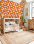 Self-adhesive wallpaper displaying whimsical white hand-drawn blooms over a vibrant matte orange surface - Zest Bloom