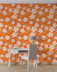 Floral adhesive wallpaper featuring hand-sketched white daisies on a flat orange background - Zest Bloom