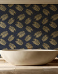 Acacia Scatter Black Gold dainty leaf wallpaper creating ambiance in a serene spa bathroom