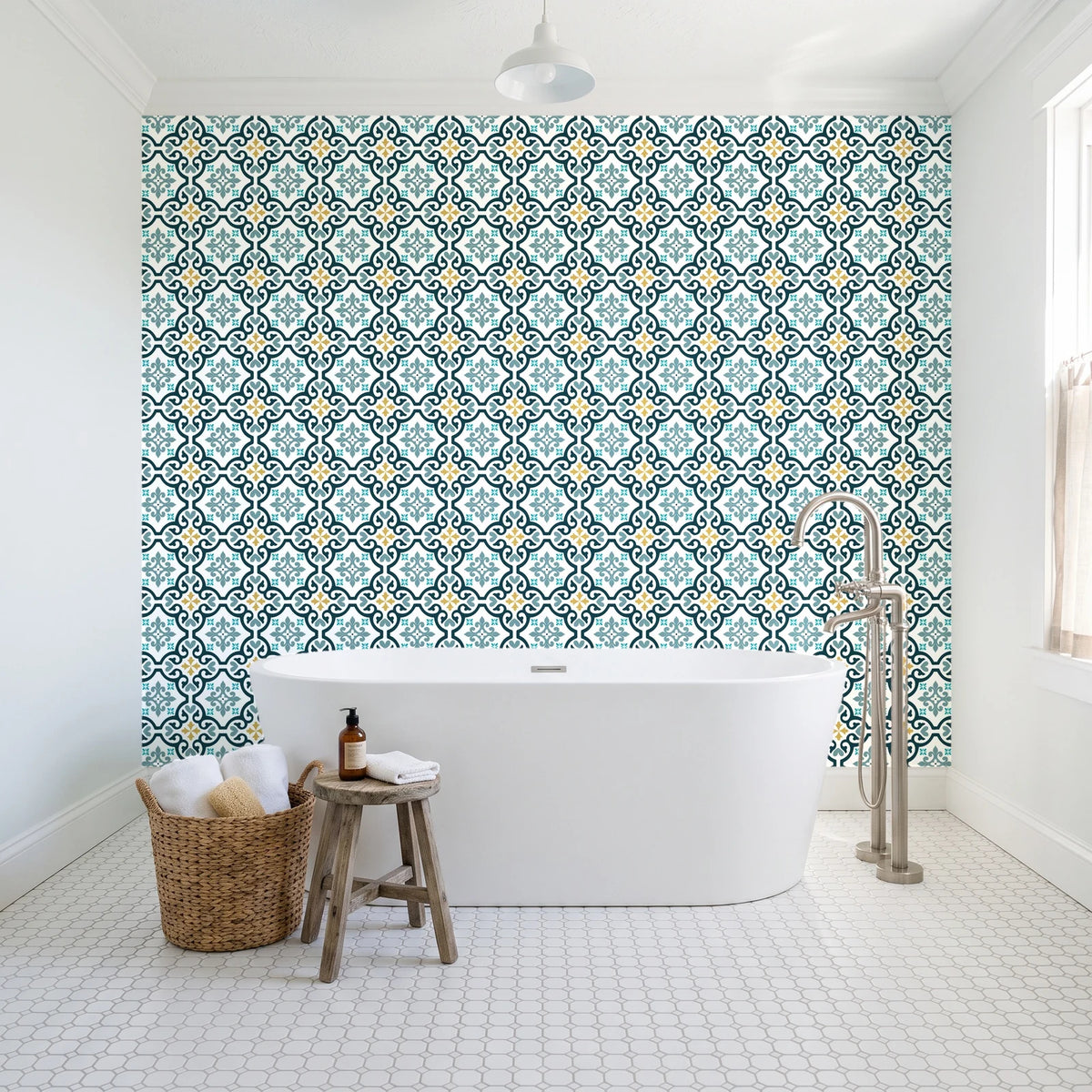 Andalusian Court Peacock encaustic tile wallpaper behind a freestanding tub in a bright coastal bathroom
