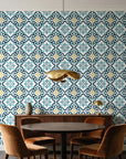 Andalusian Court Peacock encaustic tile wallpaper behind a walnut credenza and round table in an elegant dining room