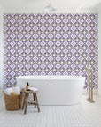 Andalusian Court Plum encaustic tile wallpaper behind a freestanding tub in a bright coastal bathroom