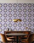 Andalusian Court Plum encaustic tile wallpaper behind a walnut credenza and round table in an elegant dining room