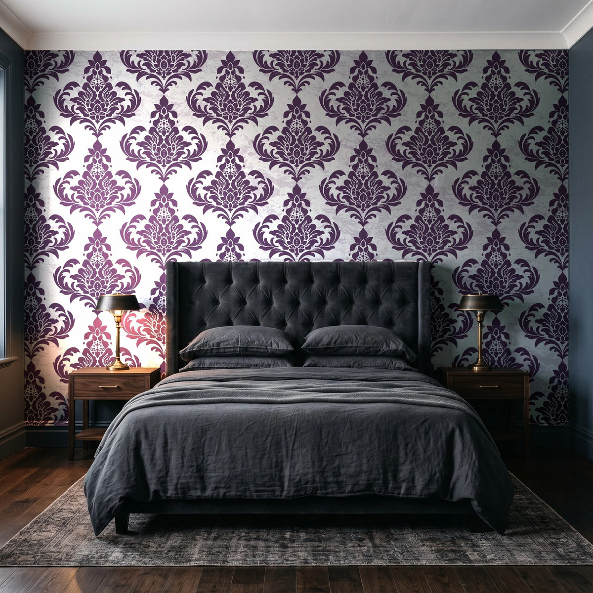 Antique Fern Mist Aubergine distressed damask wallpaper behind a tufted headboard in a dark, moody bedroom