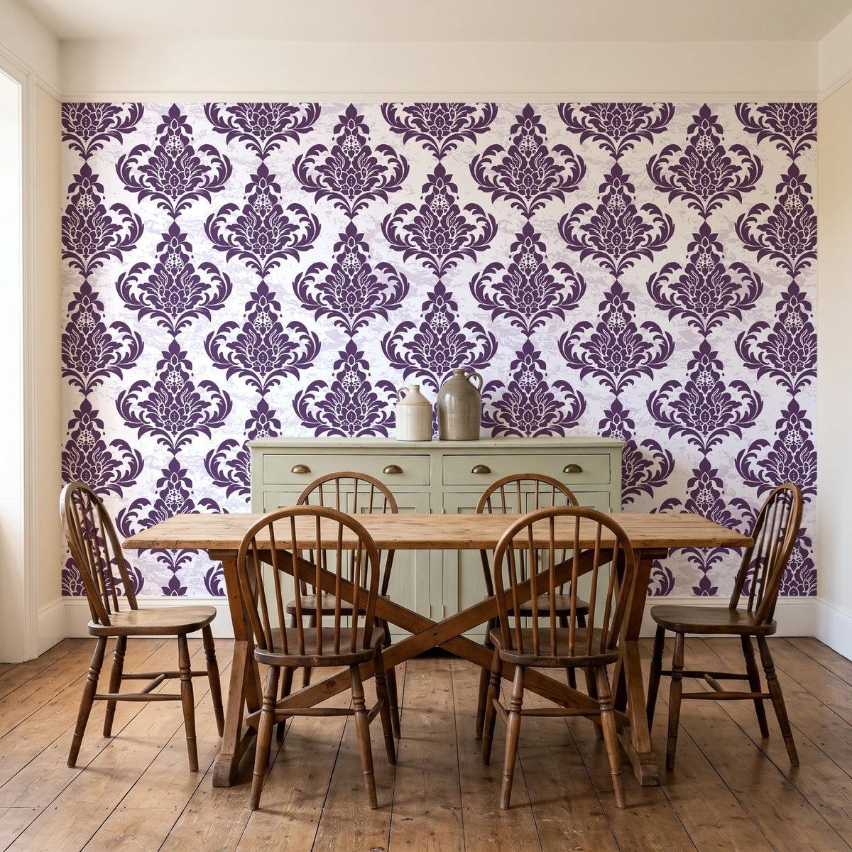 Antique Fern Mist Aubergine distressed damask wallpaper in a farmhouse dining room with a sage sideboard and rustic trestle table