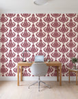Antique Fern Mist Garnet distressed damask wallpaper behind a modern oak desk in a bright home office