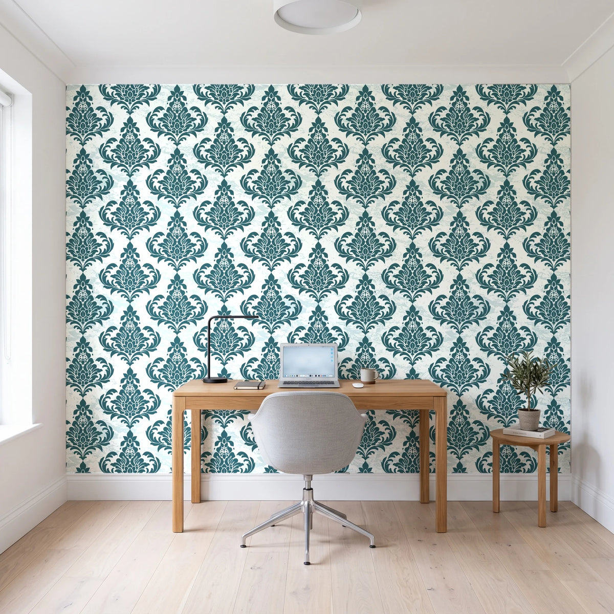 Antique Fern Mist Teal distressed damask wallpaper behind a modern oak desk in a bright home office