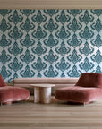 Antique Fern Mist Teal distressed damask wallpaper in a boutique hotel sitting area