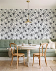 Apricot Tides Charcoal coastal seashell wallpaper as a feature wall in a sunlit breakfast nook