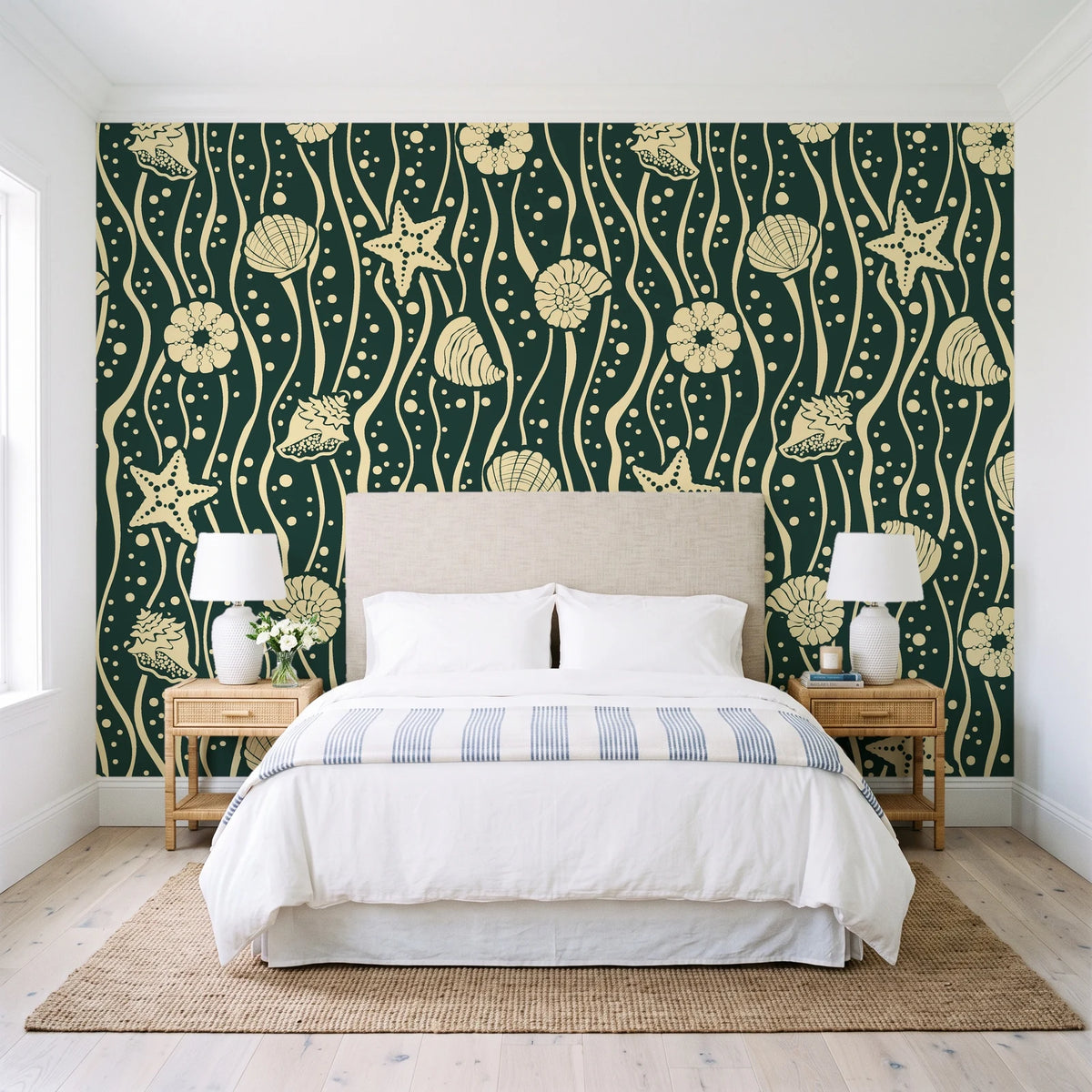 Apricot Tides Forest coastal seashell wallpaper behind a queen bed in a bright coastal bedroom