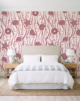 Apricot Tides Rosewood coastal seashell wallpaper behind a queen bed in a bright coastal bedroom
