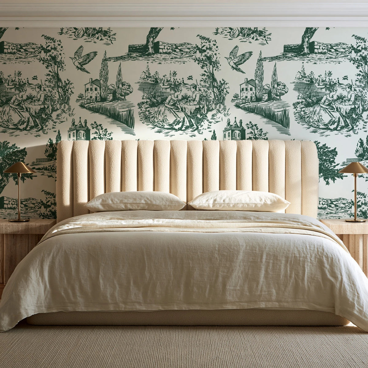 Arcadian Reverie Hunter pastoral toile wallpaper behind a channel-tufted bed in a calm primary bedroom