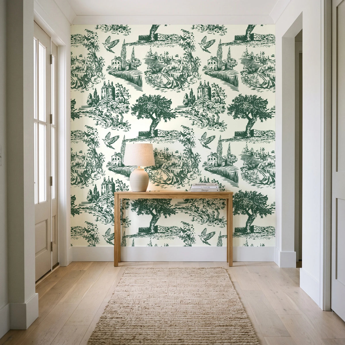 Arcadian Reverie Hunter pastoral toile wallpaper behind a console table in a light entry hallway