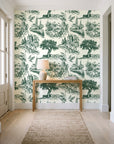 Arcadian Reverie Hunter pastoral toile wallpaper behind a console table in a light entry hallway