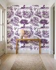 Arcadian Reverie Plum pastoral toile wallpaper behind a console table in a light entry hallway