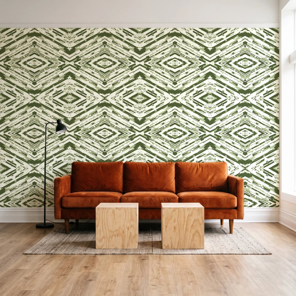 Arrows At Dawn Moss geometric diamond wallpaper behind a rust velvet sofa in a bright coworking lounge