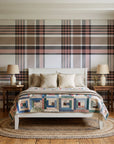 Autumn Lattice Ivory plaid wallpaper behind a white cottage bed with a patchwork quilt in a cozy cottagecore bedroom
