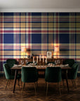 Autumn Lattice Navy plaid wallpaper in a dark moody dining room with a candlelit table