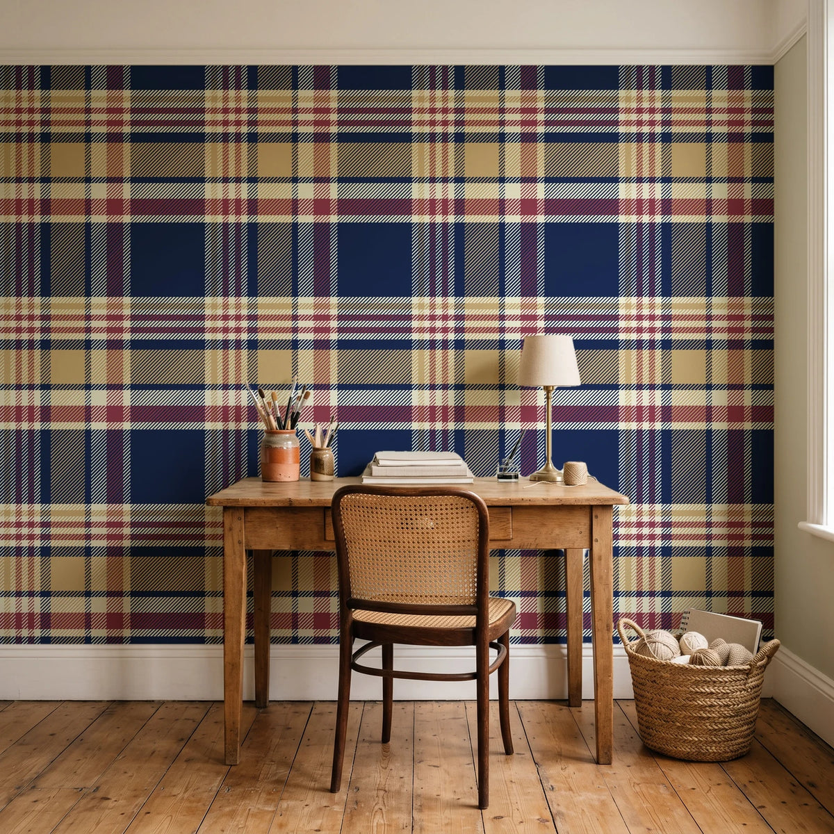 Autumn Lattice Navy plaid wallpaper behind a vintage writing desk in a cozy craft-room home office