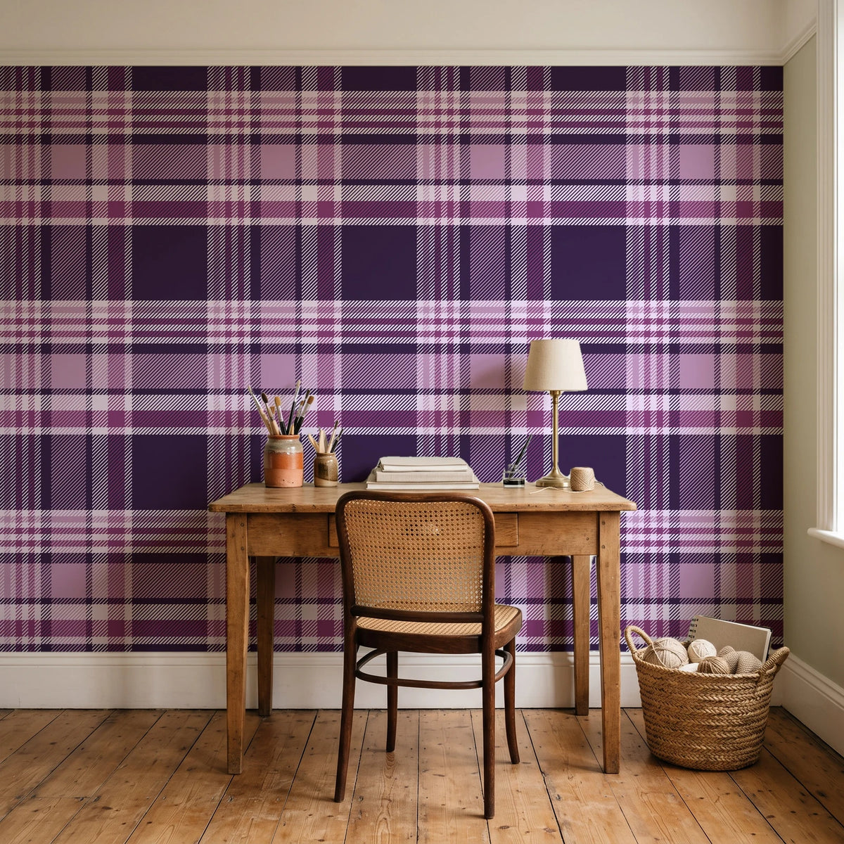 Autumn Lattice Plum plaid wallpaper behind a vintage writing desk in a cozy craft-room home office