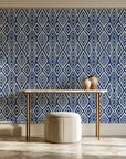 Aztec Quilt Indigo geometric tribal wallpaper on the wall of a grand entry foyer