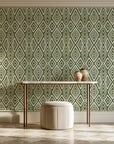 Aztec Quilt Olive geometric tribal wallpaper on the wall of a grand entry foyer