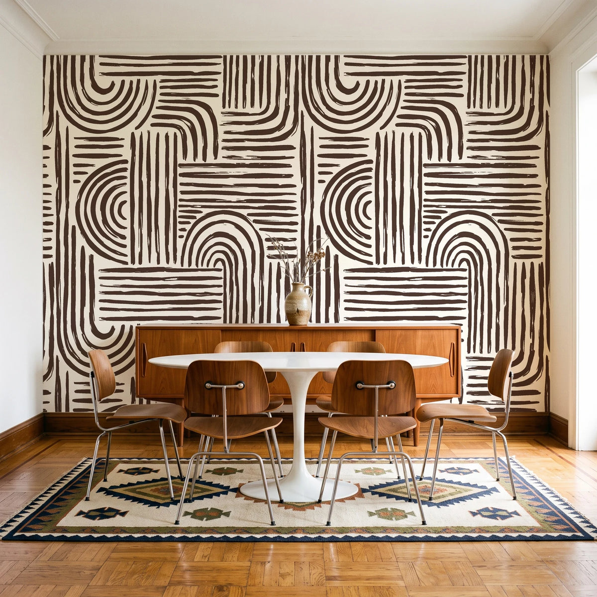 Bantu Lines Espresso brush geometric wallpaper in a mid-century dining room with a teak sideboard and tulip table