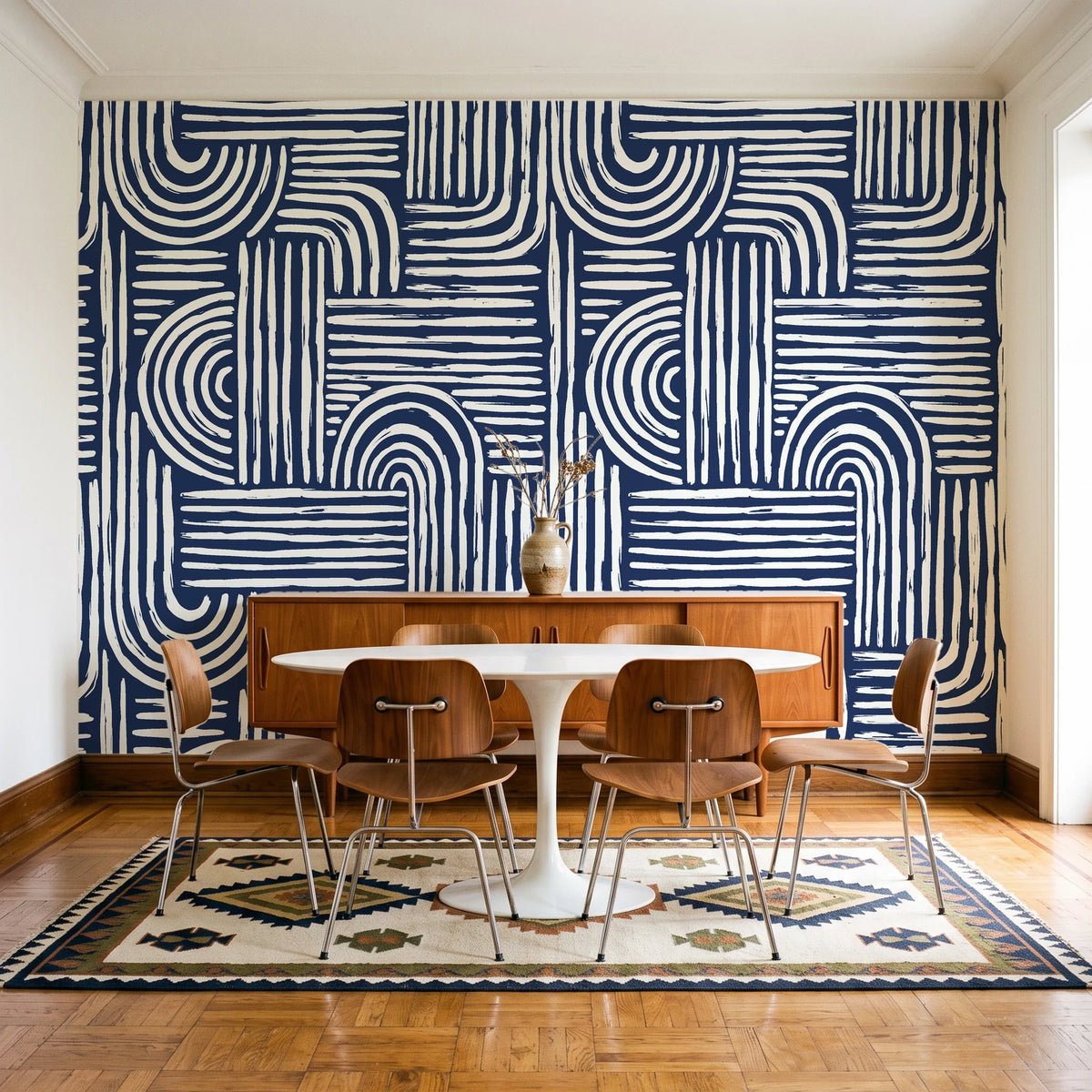 Bantu Lines Navy brush geometric wallpaper in a mid-century dining room with a teak sideboard and tulip table
