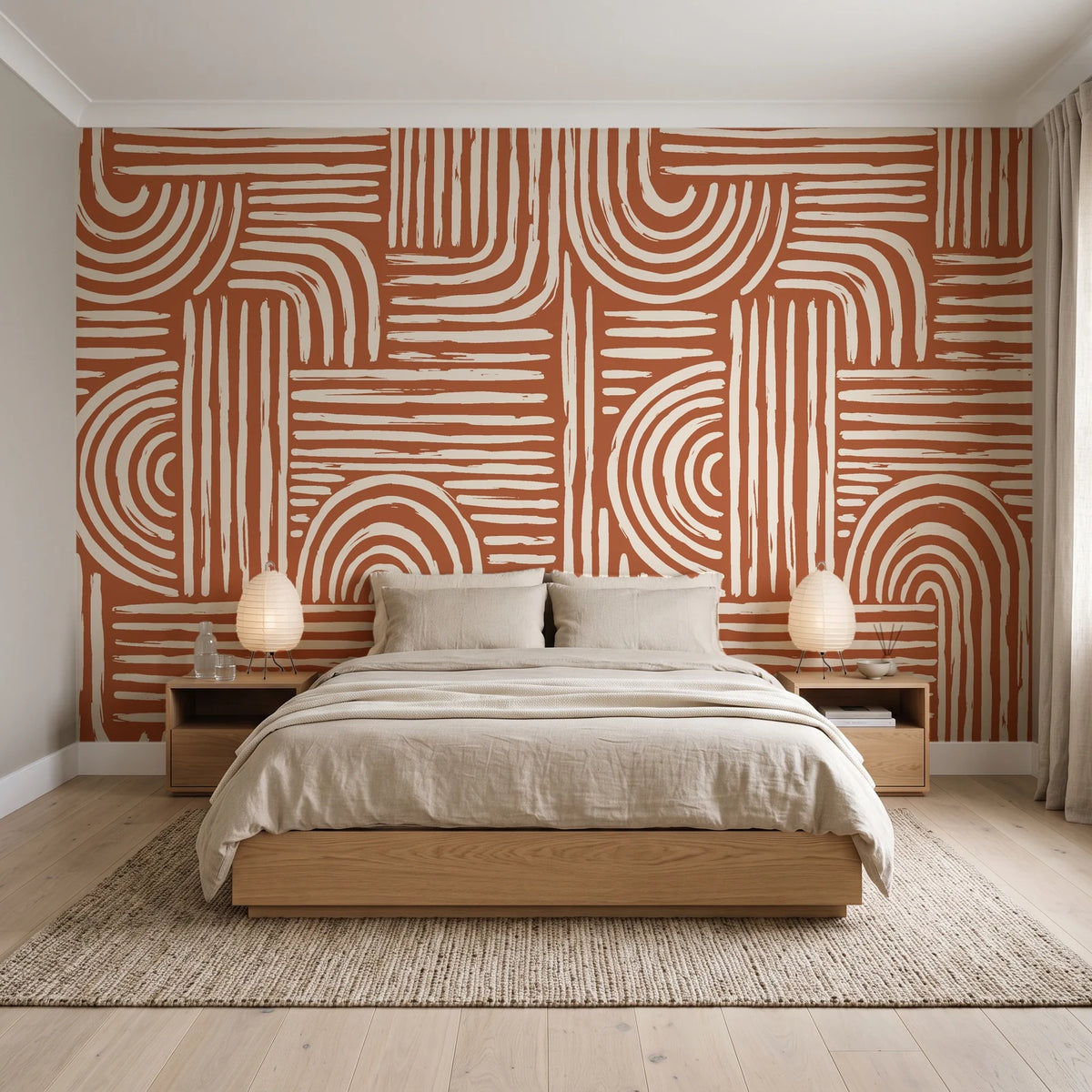 Bantu Lines Terracotta brush geometric wallpaper behind a low platform bed in a serene Japandi bedroom