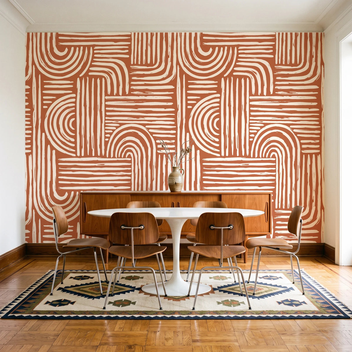 Bantu Lines Terracotta brush geometric wallpaper in a mid-century dining room with a teak sideboard and tulip table