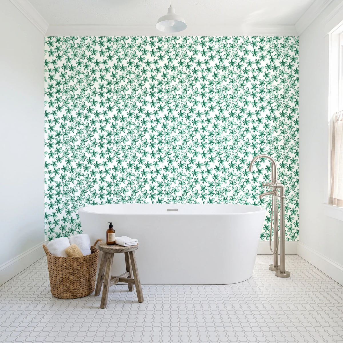 Blazing Petal Emerald hibiscus floral wallpaper behind a freestanding tub in a bright coastal bathroom