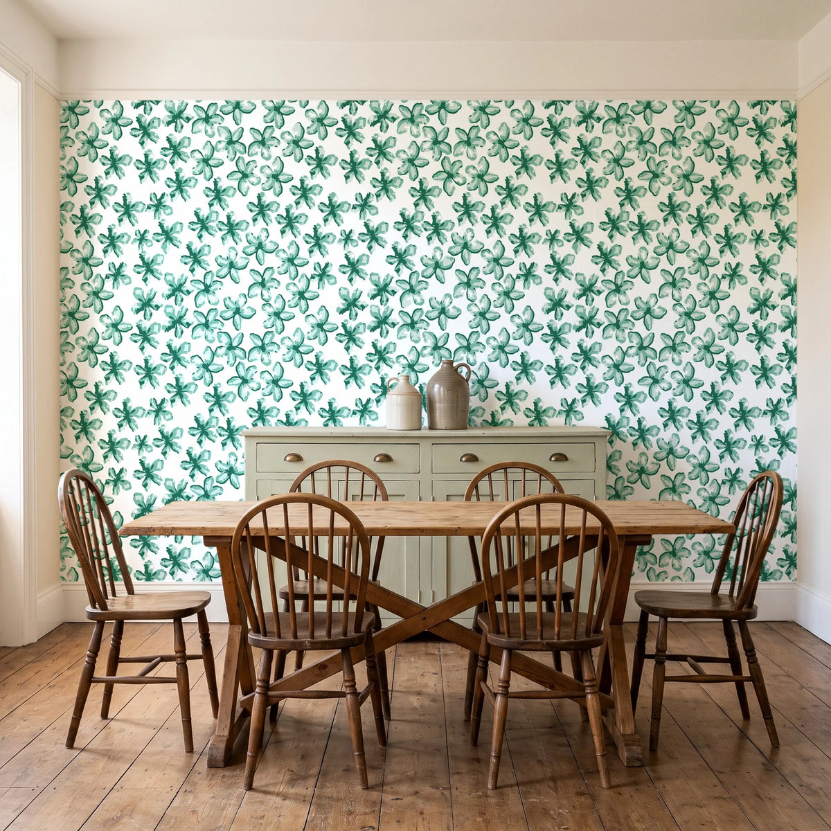 Blazing Petal Emerald hibiscus floral wallpaper in a farmhouse dining room with a sage sideboard and rustic trestle table