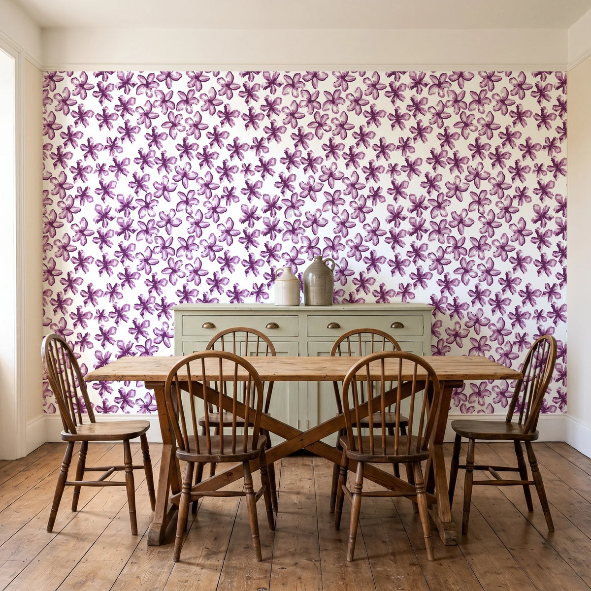 Blazing Petal Plum hibiscus floral wallpaper in a farmhouse dining room with a sage sideboard and rustic trestle table