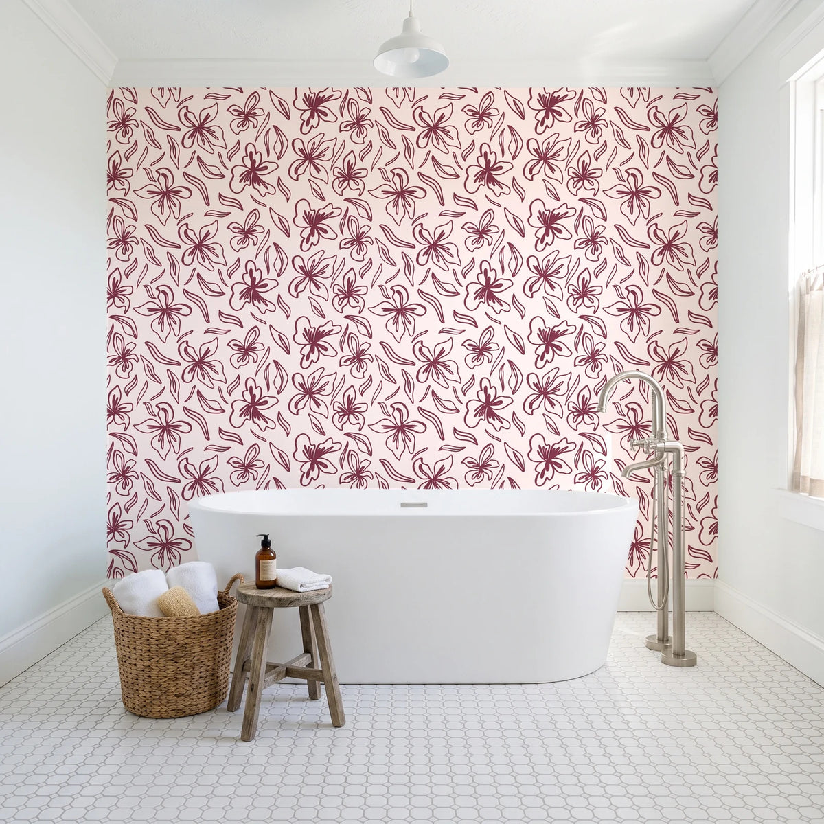 Blueprint Bloom Blush floral line wallpaper behind a freestanding tub in a bright coastal bathroom