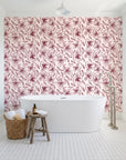 Blueprint Bloom Blush floral line wallpaper behind a freestanding tub in a bright coastal bathroom