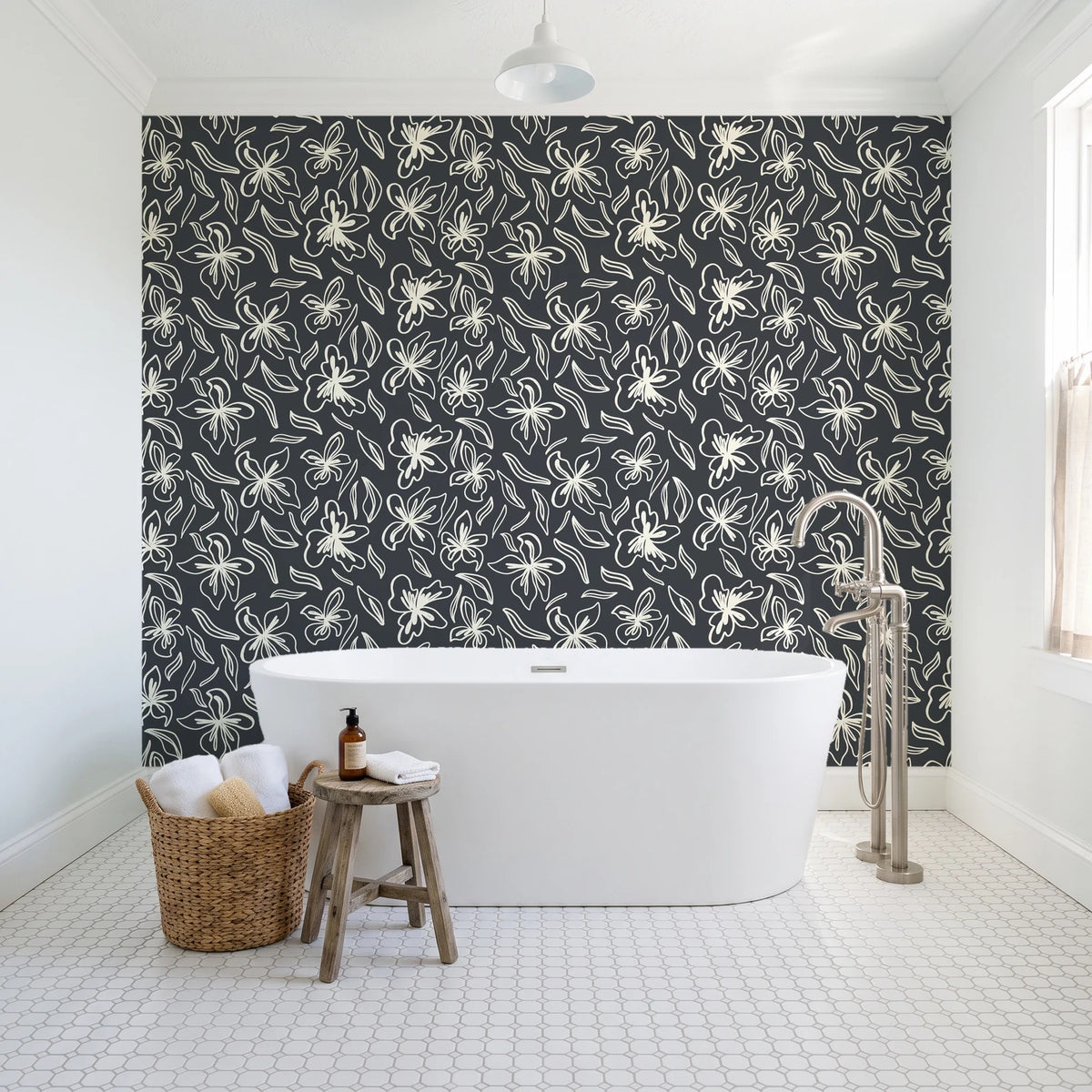 Blueprint Bloom Charcoal floral line wallpaper behind a freestanding tub in a bright coastal bathroom