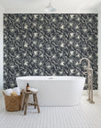 Blueprint Bloom Charcoal floral line wallpaper behind a freestanding tub in a bright coastal bathroom