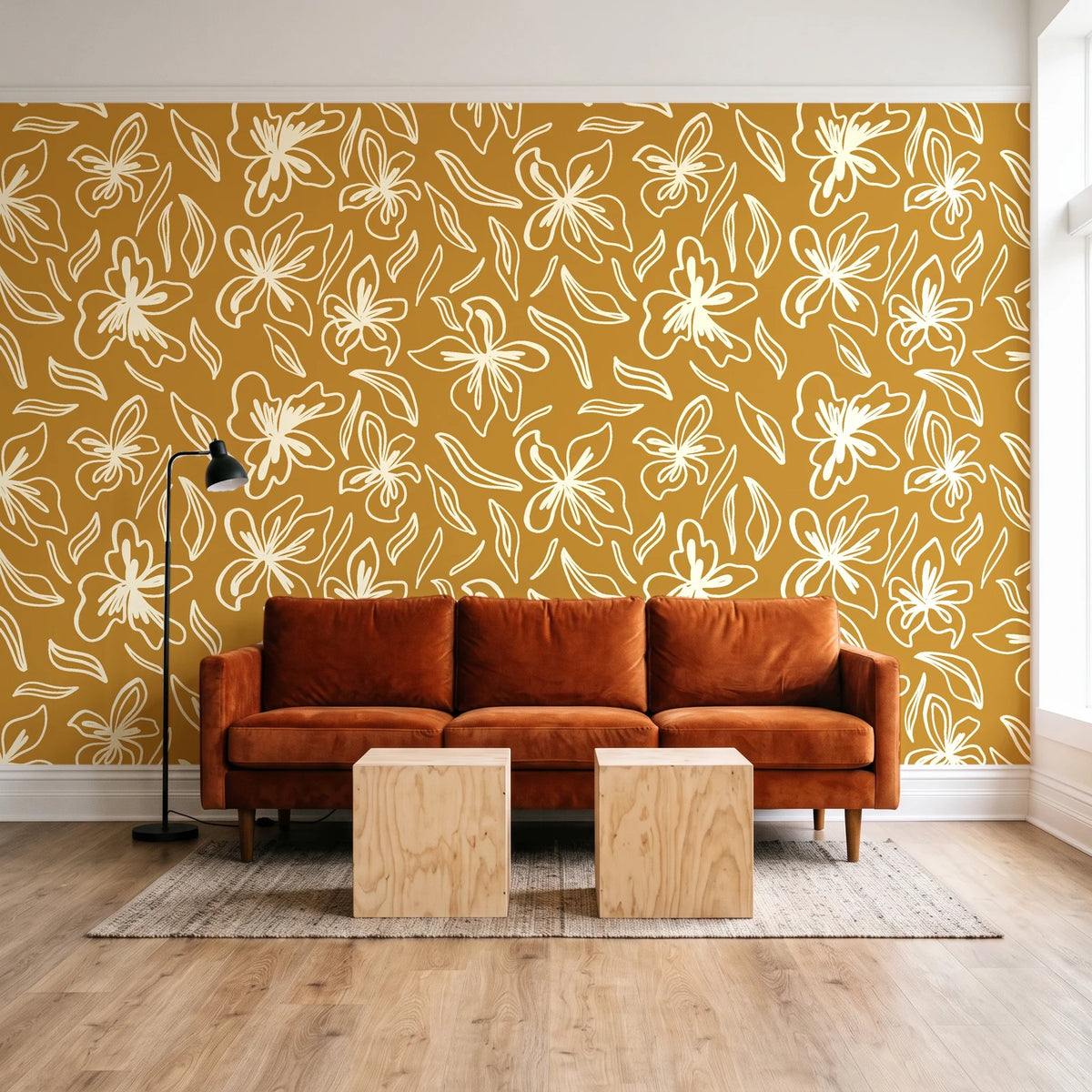 Blueprint Bloom Ochre floral line wallpaper behind a rust velvet sofa in a bright coworking lounge