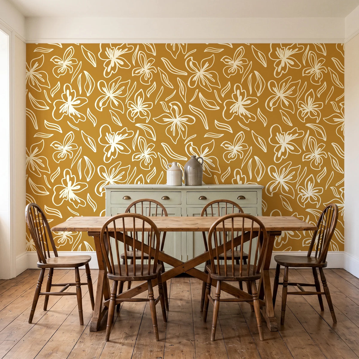 Blueprint Bloom Ochre floral line wallpaper in a farmhouse dining room with a sage sideboard and rustic trestle table