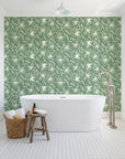 Blueprint Bloom Sage floral line wallpaper behind a freestanding tub in a bright coastal bathroom