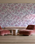 Blush Serenade Aubergine floral damask wallpaper in a boutique hotel sitting area